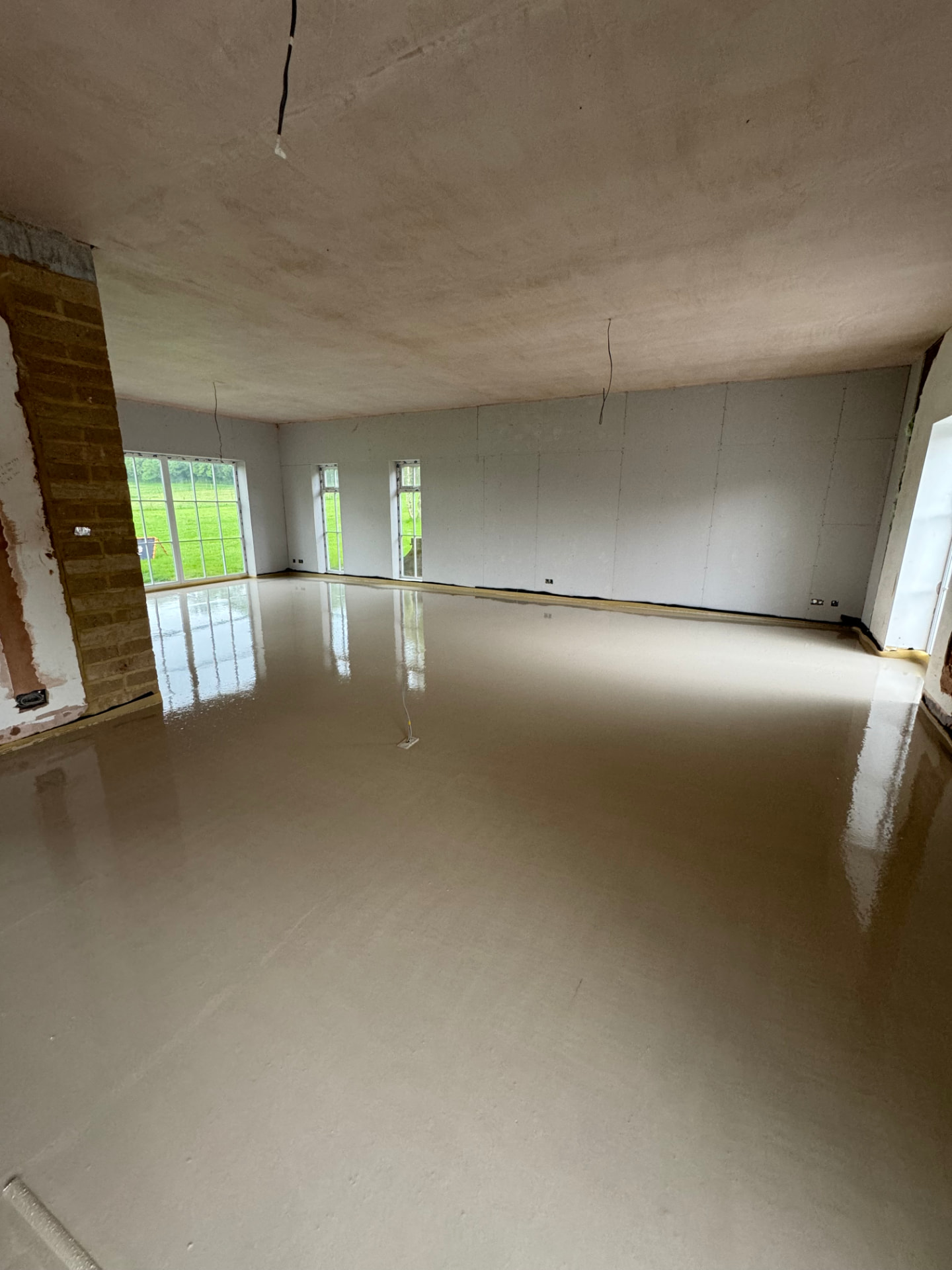 Finished liquid screed floor in a large open-plan room